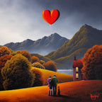 Two people standing on a hill with a red heart-shaped balloon, surrounded by mountains and trees.